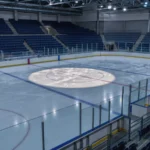 Empty ice hockey rink with blank advertising boards along the boards